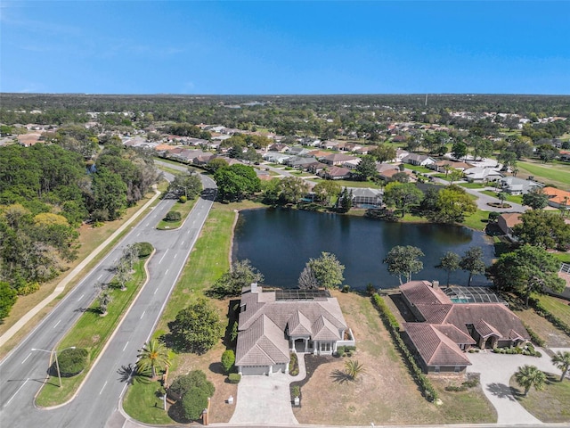 bird's eye view featuring a water view and a residential view