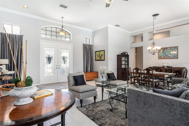 living area featuring light tile patterned flooring, french doors, visible vents, and ornamental molding