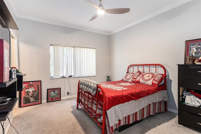 bedroom featuring baseboards, carpet floors, a ceiling fan, and crown molding