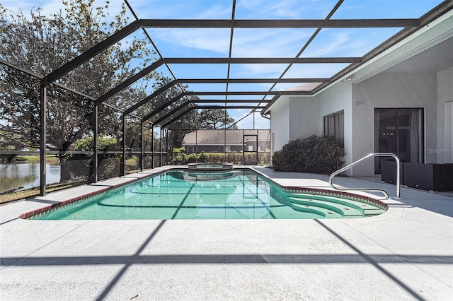 view of pool with a pool with connected hot tub, a lanai, and a patio area