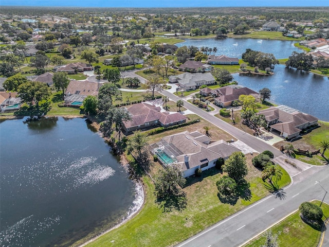 bird's eye view featuring a water view and a residential view