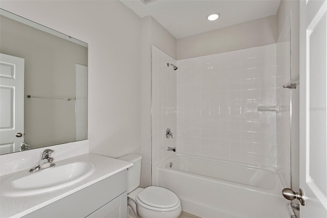 bathroom featuring toilet, shower / washtub combination, and vanity