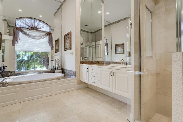 full bathroom with vanity, tile patterned floors, a bath, and a stall shower