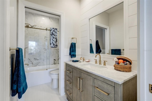 bathroom featuring vanity, toilet, washtub / shower combination, and tile patterned flooring