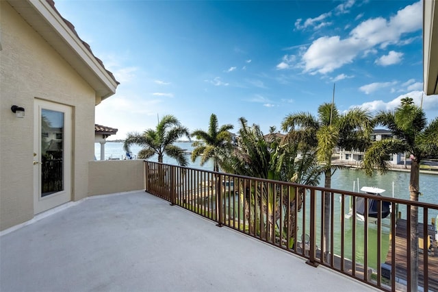 balcony featuring a water view