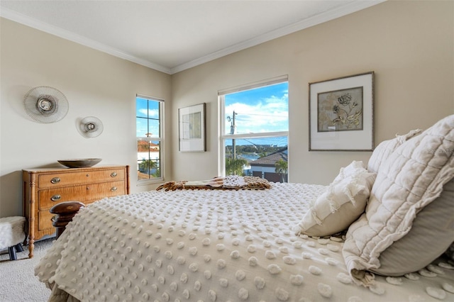 carpeted bedroom with ornamental molding