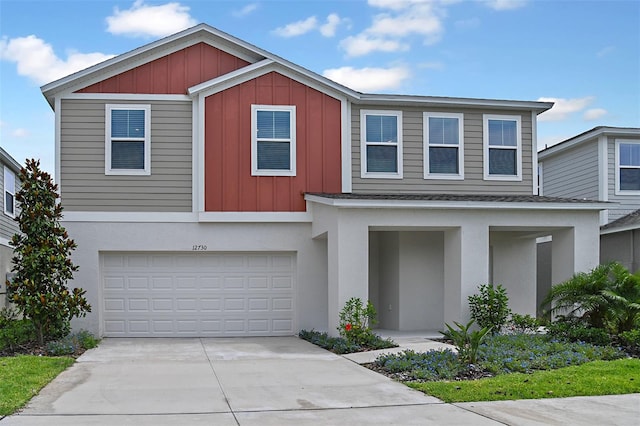 view of front of house featuring concrete driveway, a garage, board and batten siding, and stucco siding