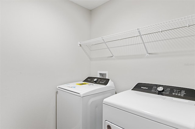 washroom featuring washer and dryer and laundry area