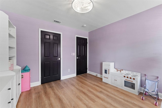 15703 Jericho Dr, Odessa, FL 33556 - playroom featuring light wood-style floors and baseboards