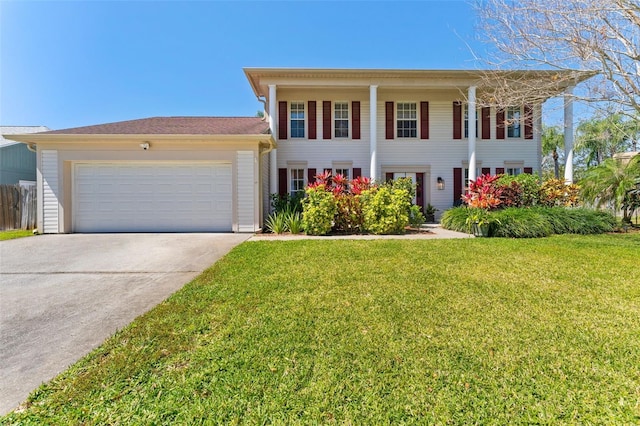 15703 Jericho Dr, Odessa, FL 33556 - neoclassical home with a front yard, a garage, and driveway