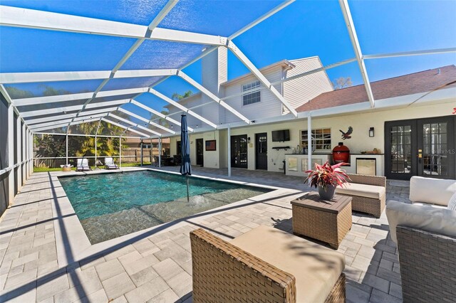 15703 Jericho Dr, Odessa, FL 33556 - outdoor pool featuring french doors, a patio area, a lanai, and an outdoor hangout area