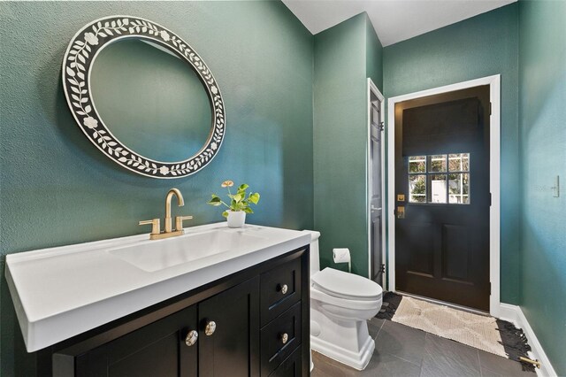 15703 Jericho Dr, Odessa, FL 33556 - bathroom featuring toilet, tile patterned flooring, vanity, and baseboards