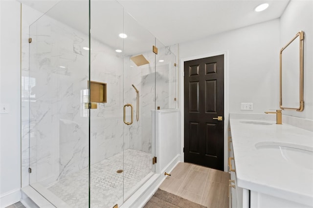 15703 Jericho Dr, Odessa, FL 33556 - full bath featuring a marble finish shower, recessed lighting, double vanity, and baseboards