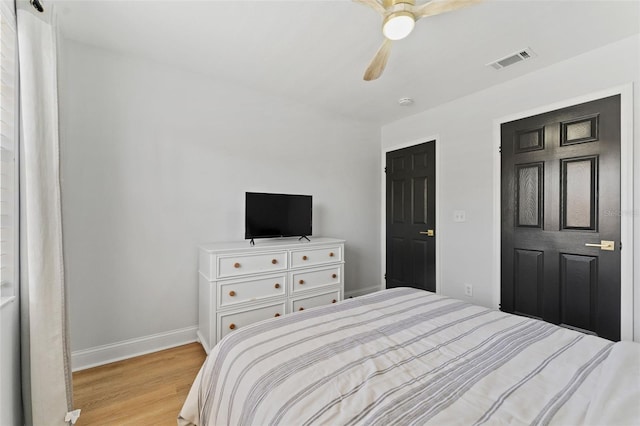 15703 Jericho Dr, Odessa, FL 33556 - bedroom with light wood finished floors, baseboards, and a ceiling fan