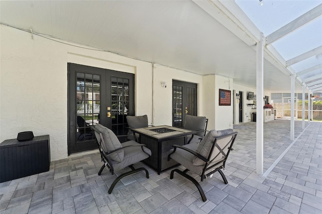 15703 Jericho Dr, Odessa, FL 33556 - view of patio / terrace featuring french doors, an outdoor fire pit, and a lanai