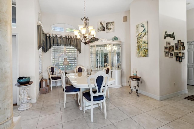 dining space with light tile patterned floors, visible vents, baseboards, and an inviting chandelier