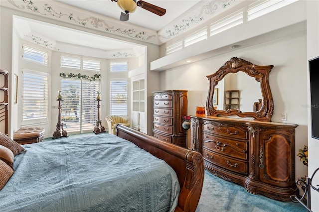 bedroom with ceiling fan, carpet, and access to exterior