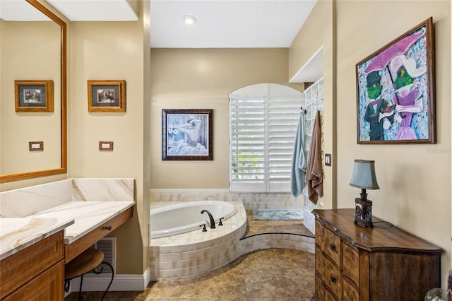 full bath featuring vanity, a garden tub, and a shower