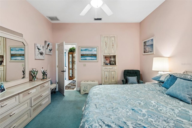 carpeted bedroom featuring visible vents and a ceiling fan