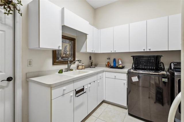 kitchen featuring a sink, white cabinetry, light tile patterned flooring, and light countertops