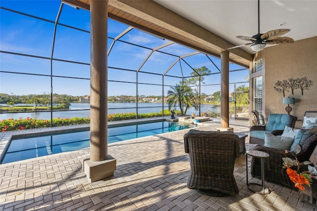 pool featuring a water view, a ceiling fan, an outdoor living space, a patio, and glass enclosure