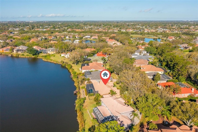 birds eye view of property featuring a water view and a residential view