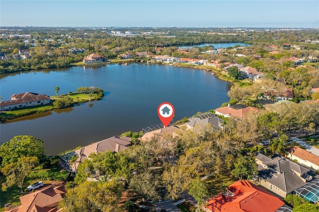 drone / aerial view with a water view and a residential view