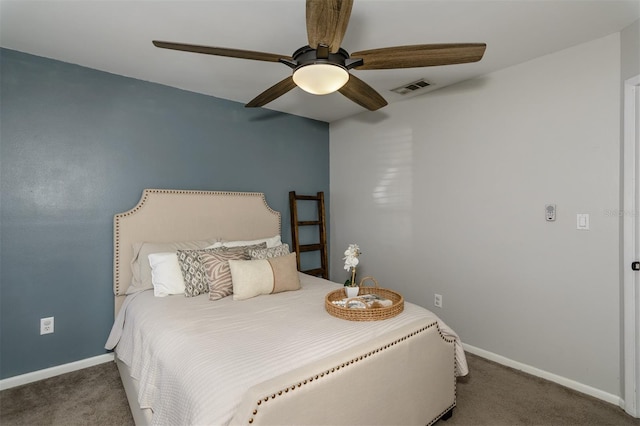 carpeted bedroom with visible vents, a ceiling fan, and baseboards