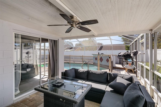 sunroom / solarium featuring wooden ceiling, plenty of natural light, and ceiling fan