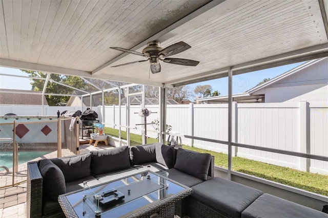 sunroom / solarium with wooden ceiling and a ceiling fan