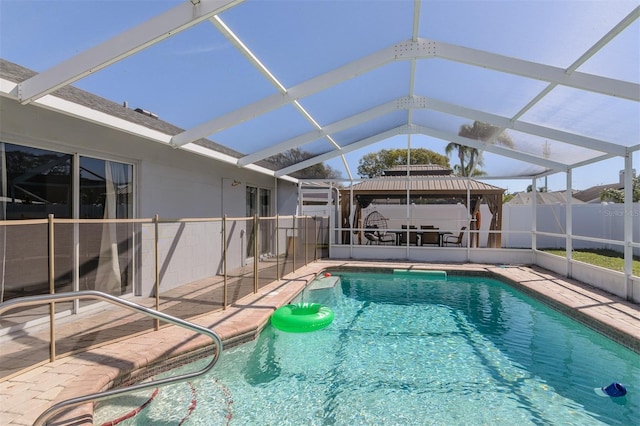 view of pool featuring a fenced in pool, glass enclosure, a patio, and fence