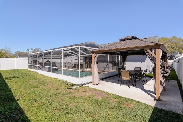 exterior space featuring a lanai, a fenced in pool, a gazebo, and a fenced backyard