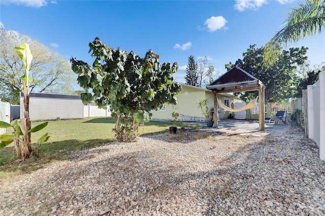 view of yard featuring a patio and a fenced backyard