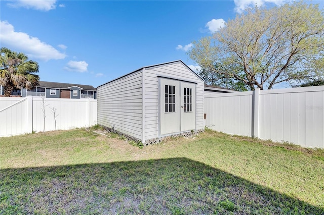 view of shed featuring a fenced backyard