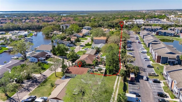 bird's eye view with a residential view and a water view