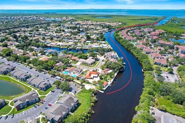 drone / aerial view featuring a water view and a residential view