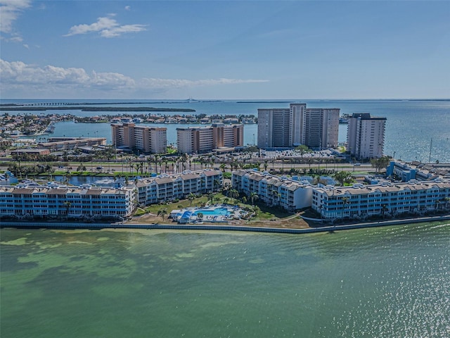 drone / aerial view with a city view and a water view