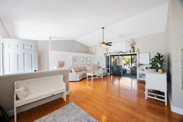 interior space with light wood-style floors and vaulted ceiling