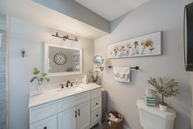 bathroom with toilet and vanity