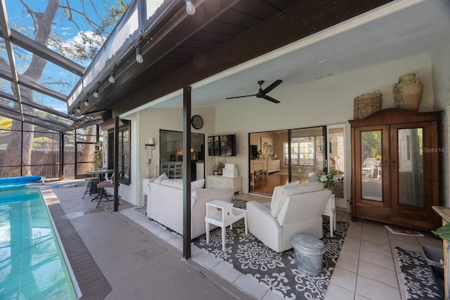 view of patio / terrace featuring glass enclosure, a fenced in pool, visible vents, and ceiling fan