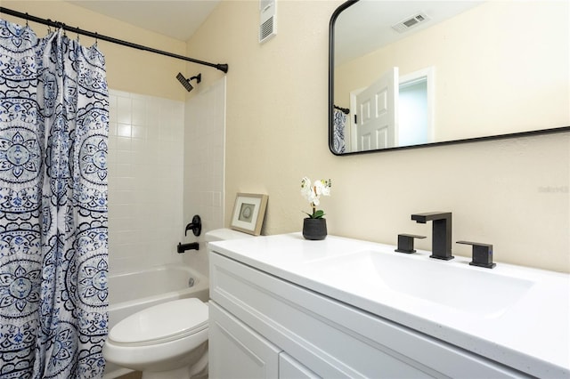 bathroom featuring visible vents, toilet, vanity, and shower / tub combo