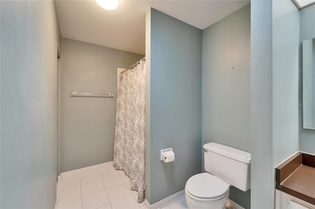 full bathroom featuring tile patterned floors, toilet, and a shower with shower curtain