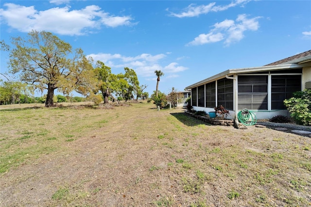 view of yard featuring a sunroom