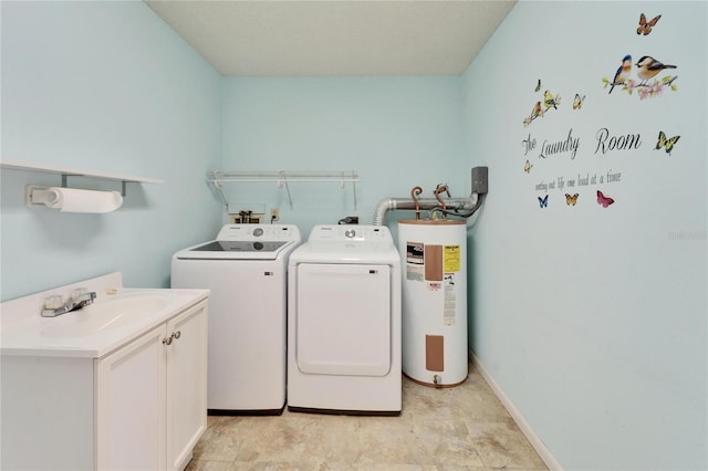 laundry area featuring washer and clothes dryer, a sink, electric water heater, cabinet space, and baseboards