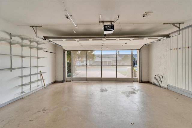 garage featuring baseboards and a garage door opener