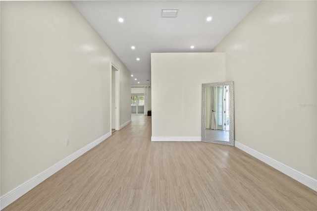 empty room with recessed lighting, visible vents, baseboards, and light wood-style floors