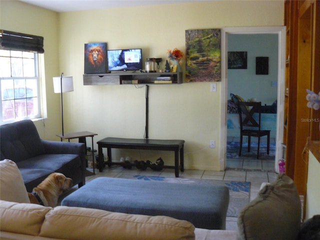 living area with tile patterned flooring