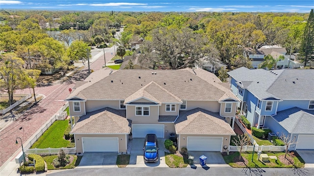 bird's eye view featuring a forest view and a residential view