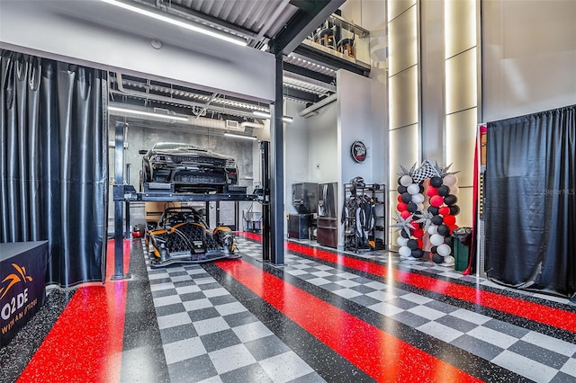 gym featuring a towering ceiling