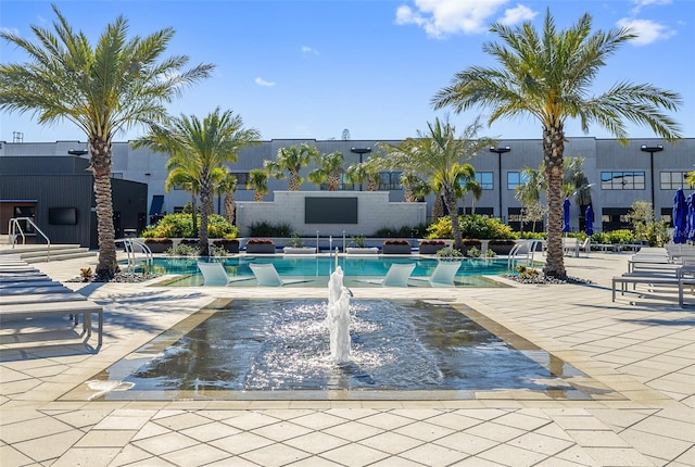 community pool featuring a patio area